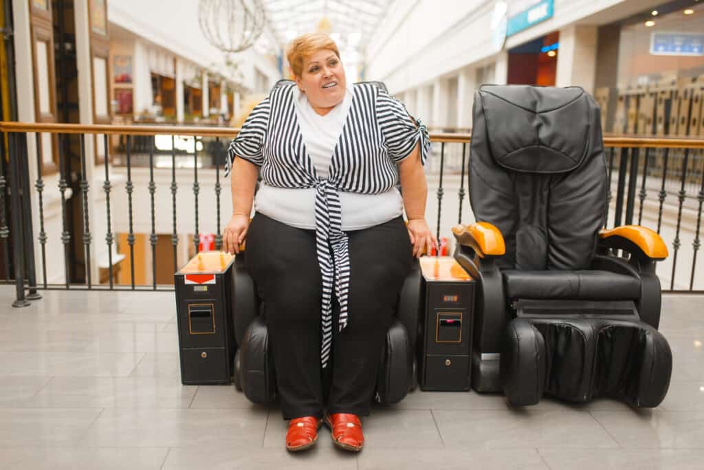 large lady sitting in massage chair