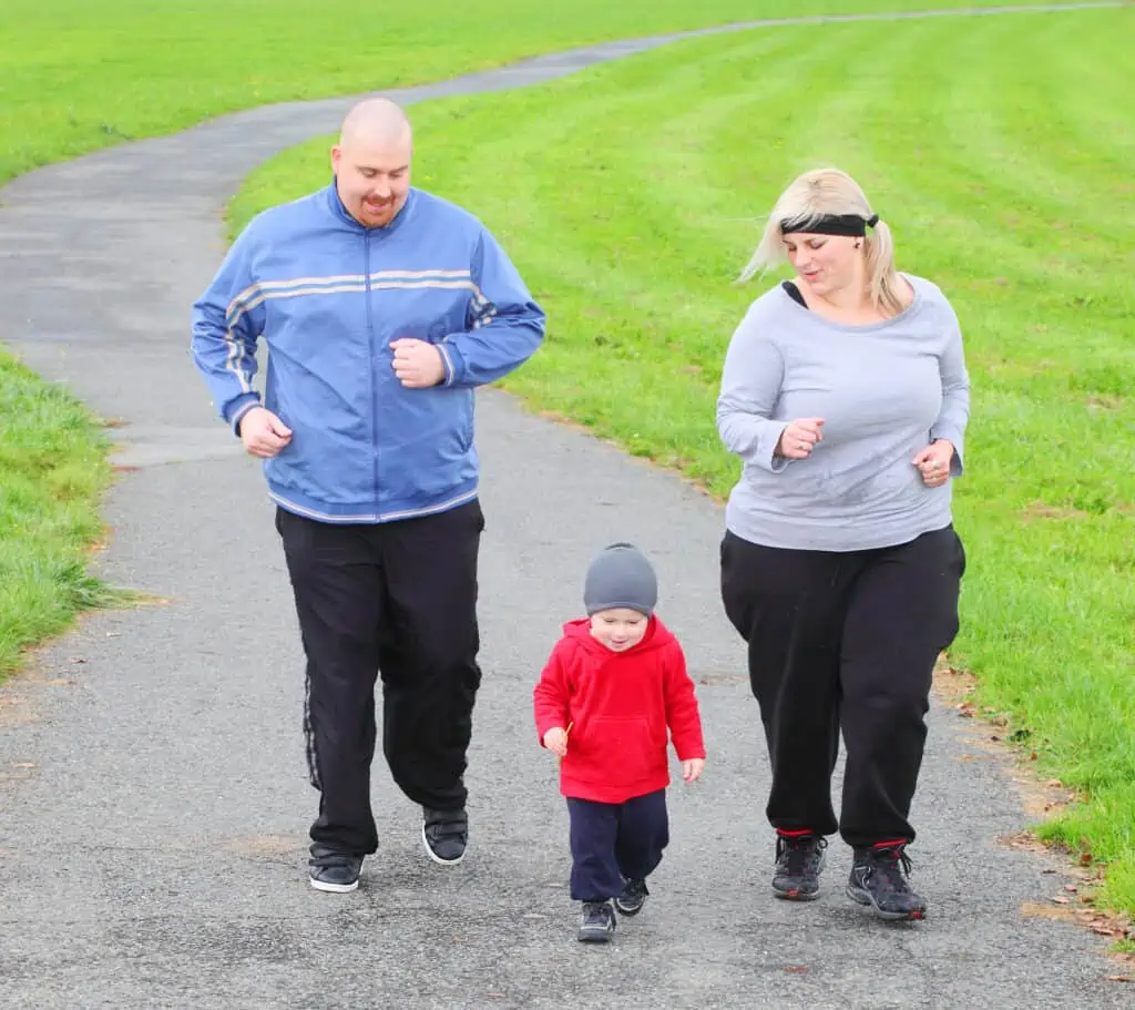 obese family running together
